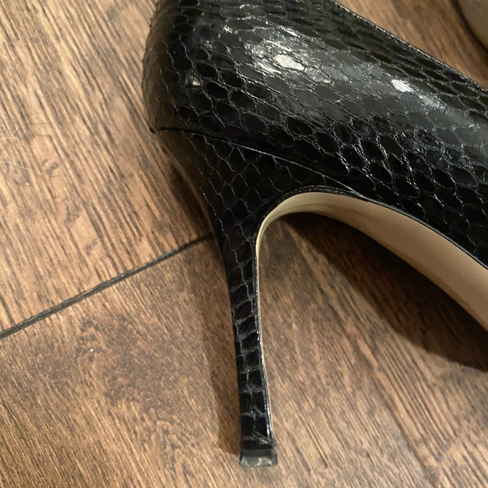 Black snake skin retro Manolo Blahnik classic heels. Very gently used.